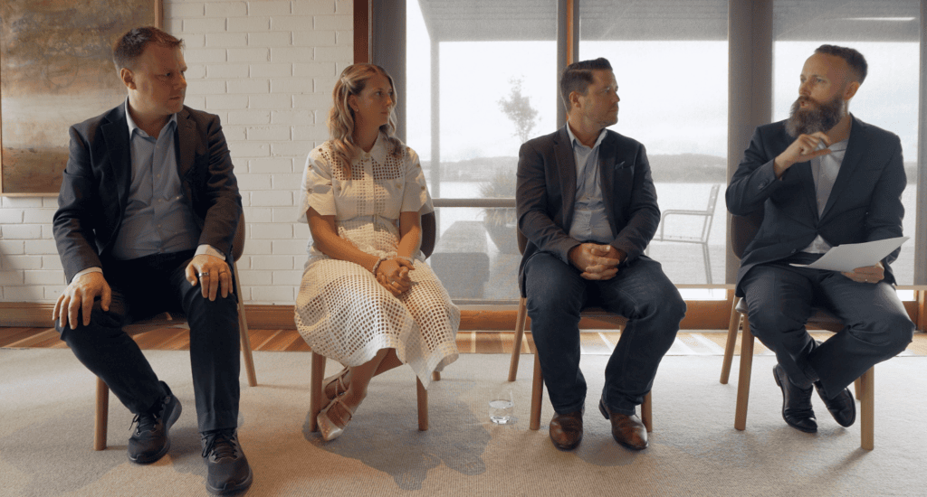 Business team discussion at a conference or seminar, professional networking event.